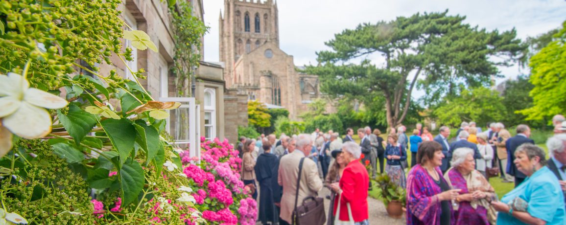 People socialising outside Bishops Palace