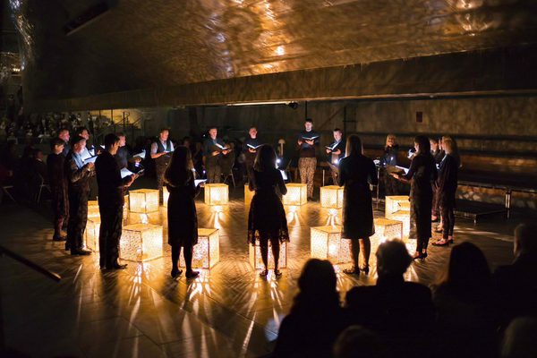 A photograph of the ORA singers in concert.