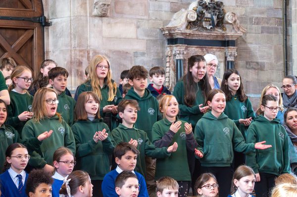 Schoolchildren singing on a stage