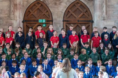 Schoolchildren singing on a stage