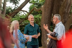 Festivalgoers chatting in a garden