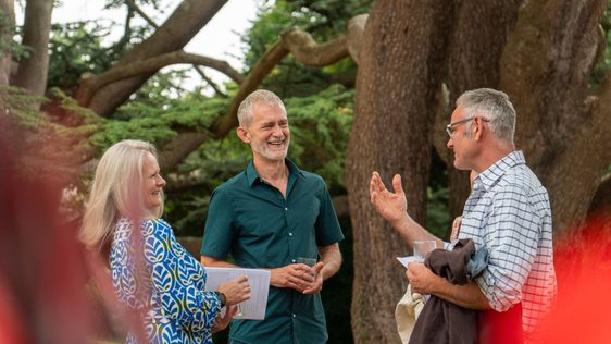 Festivalgoers chatting in a garden