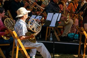 A horn player at the Festival Bandstand