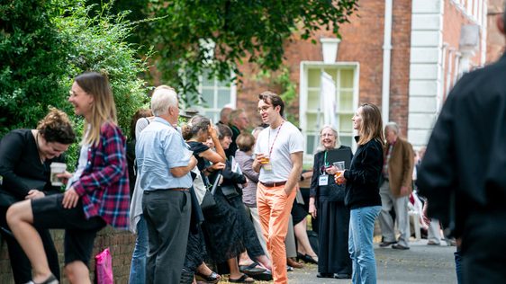 People socialising in the Festival Village