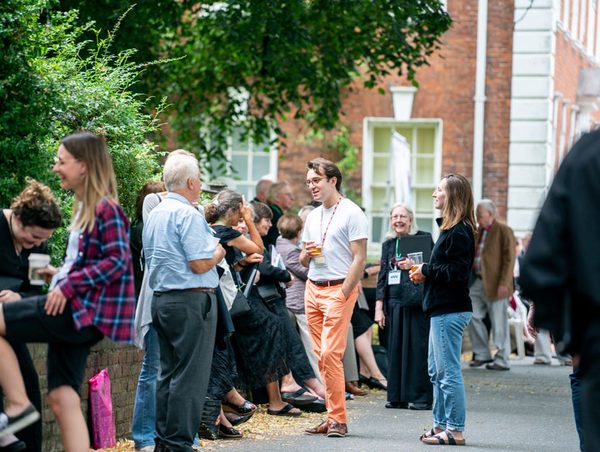 People socialising in the Festival Village